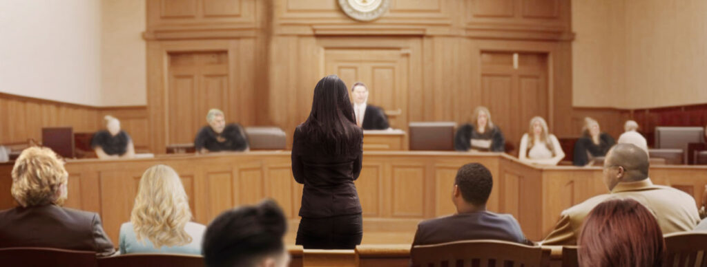 person-standing-alone-in-front-of-courtroom