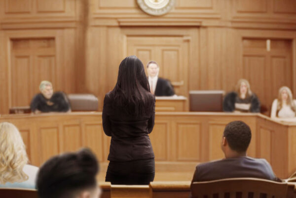 person-standing-alone-in-front-of-courtroom